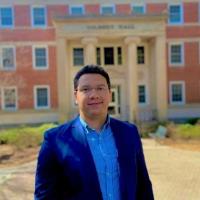 Picture of Daniel Ferreira da Silva in front of Gilbert Hall, Department of Romance Languages at the University of Georgia